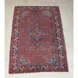 A Persian Bidjar red and blue ground rug with central medallion 79" x 52" There is some flecking