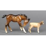 A Beswick figure - Jersey calf 2 3/4" and a ditto foal 6 3/4" The calf has a stuck leg