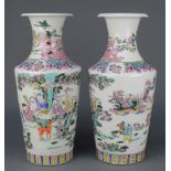 A pair of Chinese famille rose vases decorated with figures and deer in an extensive landscape 17"