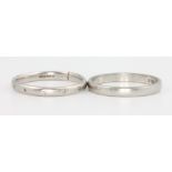 Two platinum wedding bands, 1 set with diamonds, both size K 1 ring has been cut