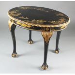 A 1920's oval black lacquered chinoiserie centre table with gadrooned border raised on carved ball