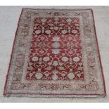 A Caucasian style rug with floral field to the centre 73" x 59"