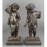 A pair of 19th Century Continental bronze figures of standing boy and girl cherubs depicting