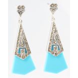 A pair of turquoise set ear drops