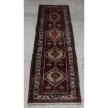 A white and brown ground Persian Nahavand runner with 4 diamonds to the centre 131" x 40" Signs of