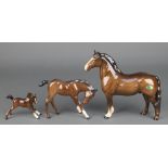 A Beswick figure of a standing horse 7 1/2", 2 Royal Doulton figures of foals 3" and 4" The