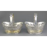 A pair of Dutch silver pierced baskets with swing handles, import marks London 1898 210 grams, 4"