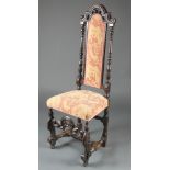 A Carolean carved oak high back chair with upholstered seat and back, raised on carved supports with