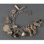 A silver charm bracelet 88 grams