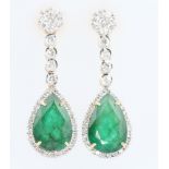 A pair of 18ct white gold diamond and emerald ear drops, the emeralds approx. 6.87ct, the