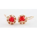 A pair of 14ct yellow gold red gem set ear clips