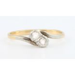 An 18ct yellow gold 2 stone diamond ring, size M 1/2