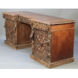 A Victorian heavily carved oak inverted breakfront pedestal sideboard fitted 2 short drawers above