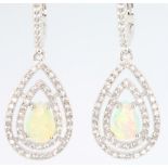 A pair of silver cubic zirconia and gem set pear shaped earrings