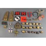 A Royal Naval transport officer's cap badge, various cloth divisional badges, buttons etc