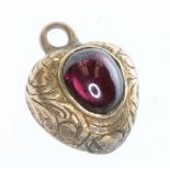 A Victorian gold heart shaped pendant with cabochon cut garnet