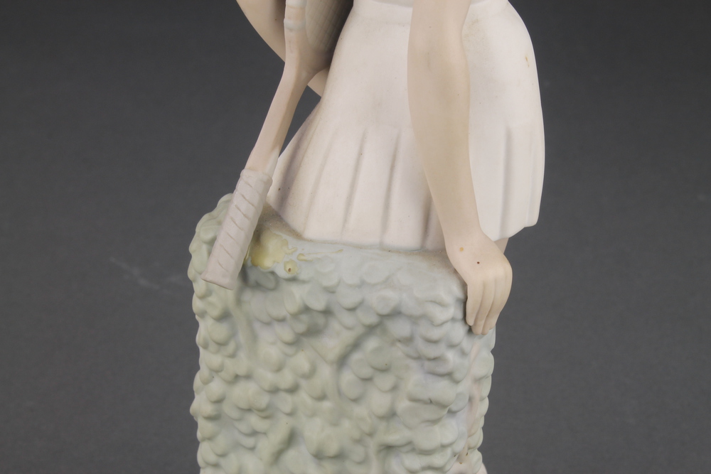 A matt Lladro figure of a lady tennis player 12 1/2" and a Continental figure of a girl with bird 8" - Image 2 of 2