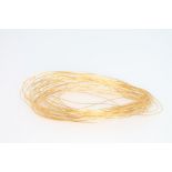 A coil of 24ct yellow gold wire, tested and verified approx. 16 grams