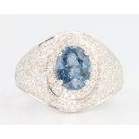 A 14ct white gold sapphire and diamond ring, the centre stone approx. 2.65ct flanked by brilliant