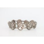 A silver 9 plaque bracelet with female portrait busts