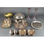 A silver plated entree dish, a pair of plated candlesticks and minor plated items