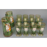 A set of 12 late 19th Century Continental green glass and enamelled beakers together with 2 jugs