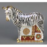 A Royal Crown Derby Imari pattern zebra paperweight with gold stopper 7"