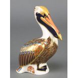 A Royal Crown Derby Imari pattern brown pelican paperweight with gold stopper 5"