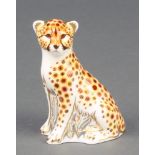 A Royal Crown Derby Imari pattern cheetah cub paperweight with gold stopper 3"