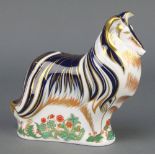 A Royal Crown Derby Imari pattern rough collie paperweight with gold stopper 7"