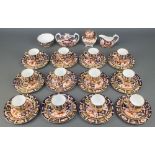 A Royal Crown Derby Japan pattern coffee set comprising 12 coffee cups, 12 saucers, 12 plates, a