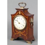 An Edwardian 8 day timepiece with enamelled dial and Arabic numerals contained in an inlaid mahogany