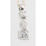 An 18ct white gold 3 stone diamond pendant, comprising 1 brilliant cut stone 0.10ct, a marquise