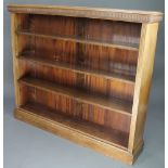 Weir & Hamilton of Glasgow, an Edwardian mahogany bookcase with fluted decoration, fitted adjustable