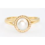 An 18ct yellow gold pearl set dress ring size L 1/2