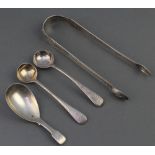 A George IV silver caddy spoon of plain form, 2 mustard spoons and a pair of nips 65.9 grams