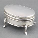 An Edwardian oval silver trinket box on pad feet Birmingham 1908 2 1/2" There are minor dents to