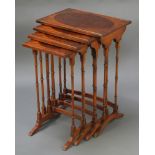 A quartetto of Georgian style rectangular mahogany and figured walnut interfitting coffee tables,