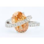 An 18ct yellow gold orange cubic zirconia and diamond ring, diamonds approx. 0.4ct size 0 1/2