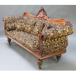 A William IV carved show frame mahogany sofa with carved and pierced back, raised on turned supports