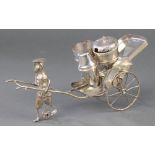 A Malaysian silver novelty condiment in the form of a gentleman pulling a cart, 138 grams, 7"