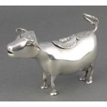 A Continental silver cow creamer with chased floral decoration 165 grams, 5 1/2"