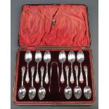 A set of 12 Victorian silver fancy teaspoons and nips in fitted case Sheffield 1900, 350 grams