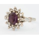 An 18ct white gold oval amethyst and diamond ring size J 1/2