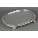 A William IV silver oval stand with acanthus decoration with a later silver insert and a wooden base