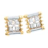 A pair of 18ct yellow and white gold diamond studs with screw backs 4.8 grams