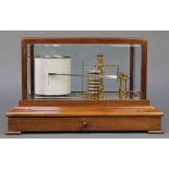 Casella of London, a barograph contained in a mahogany and bevelled glass case, the base fitted a