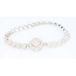 A cubic zirconia and silver heart link line bracelet
