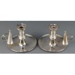 A pair of 19th Century silver plated chamber candlesticks with snuffers