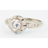 An 18ct white gold diamond ring, the centre stone approx. 0.7ct colour F, clarity VS1, with 3